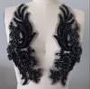 Black beaded embroidery patches on a mannequin