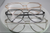 Three pairs of Detroit brand Bellz Coutre eyeglasses with different frame colors on a white background