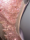 Closeup view of rhinestone bodice on luxury dress by Bellz Couture